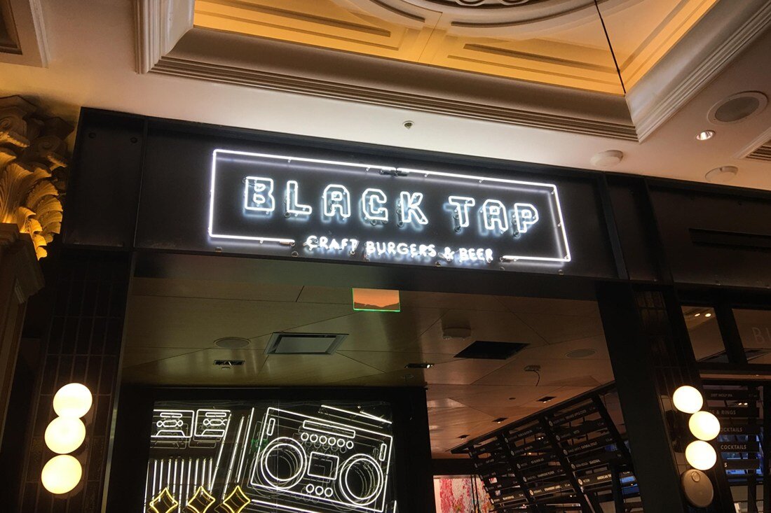 Black tap entrance neon sign