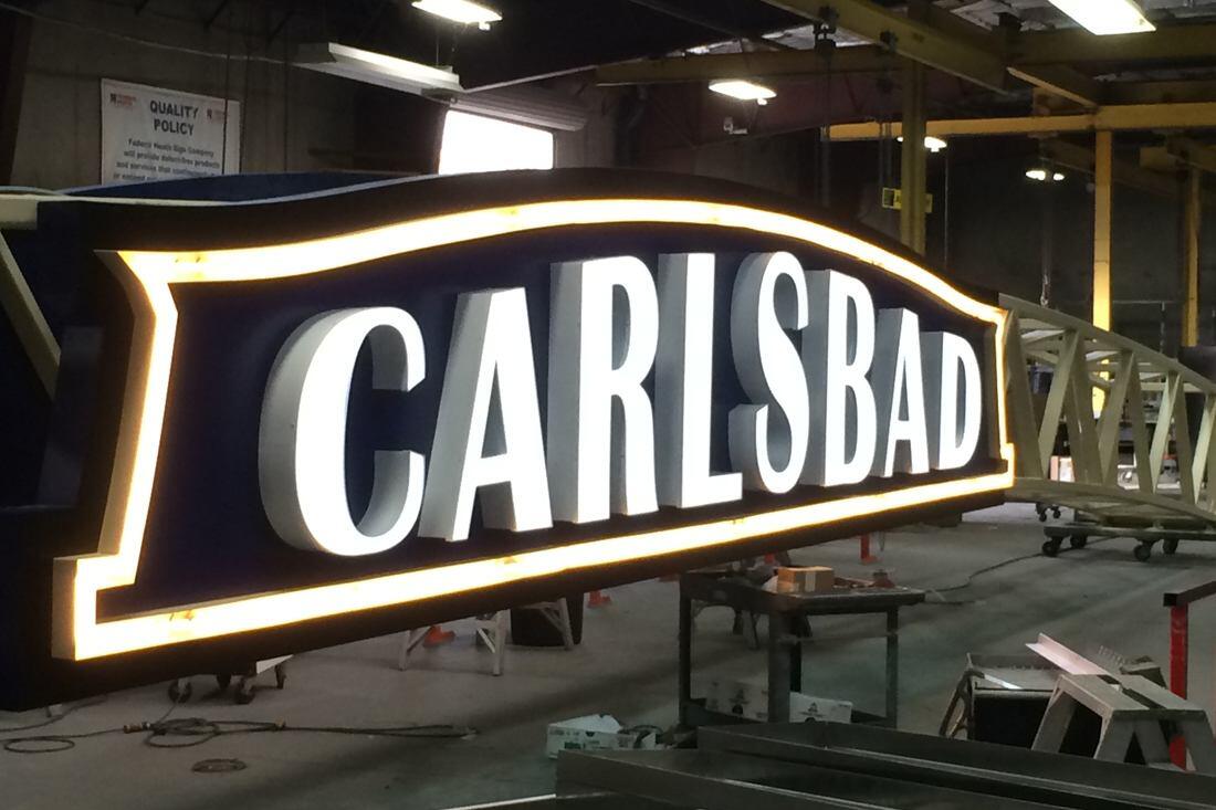 Carlsbad archway sign on flatbed truck