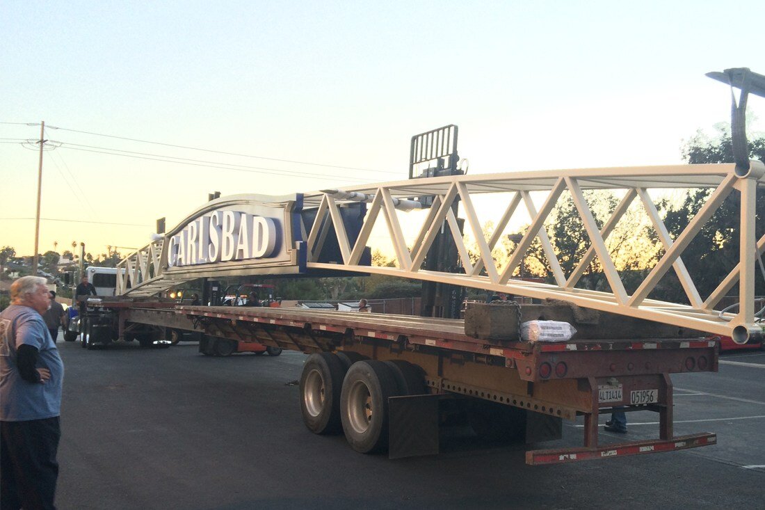 Carlsbad archway sign on flatbed truck