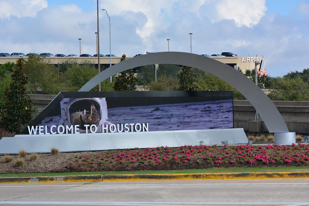 custom sign for houston airport system showing astronaut on screen